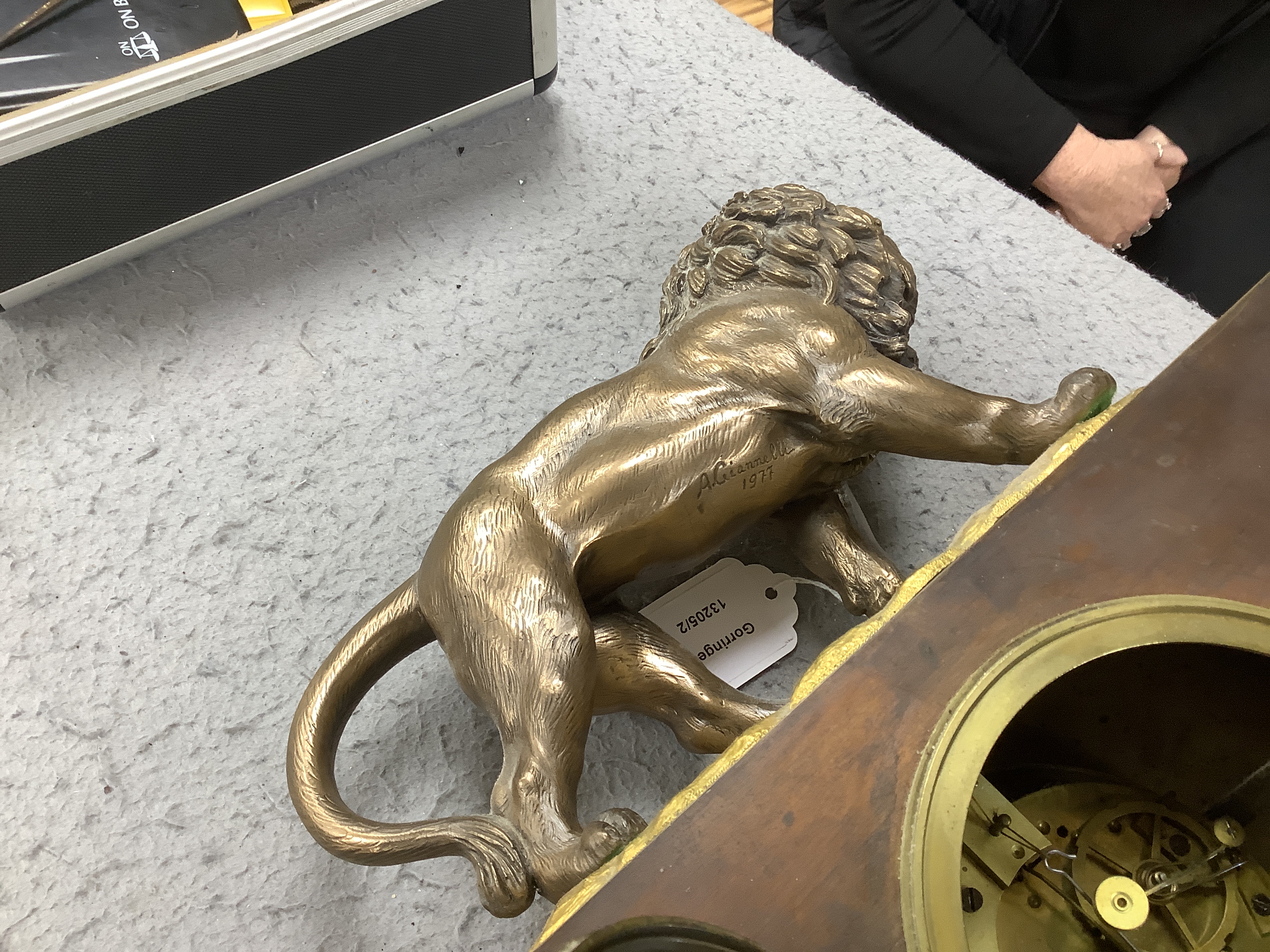 A French gilt mounted lion mantel clock with a silk suspension movement striking on a bell, 43cm high